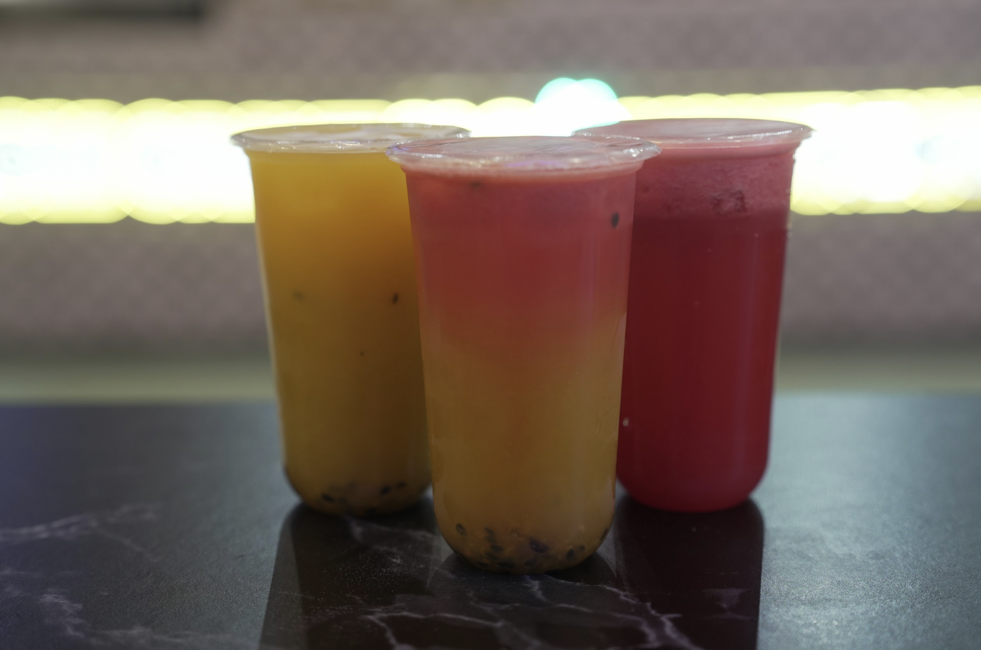 Three freshly pressed Crave signature juices in tall cups